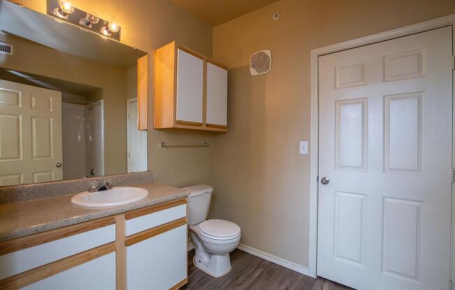 a kitchen with a sink and a mirror