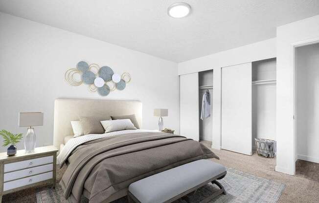 A bedroom with a large bed and a bench in front of it.