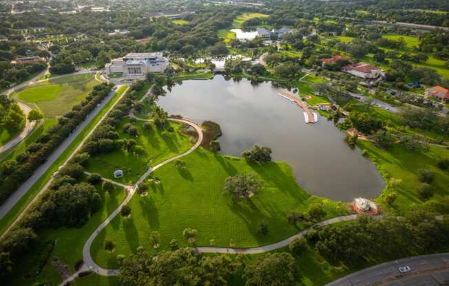 an aerial view of a park and a lake