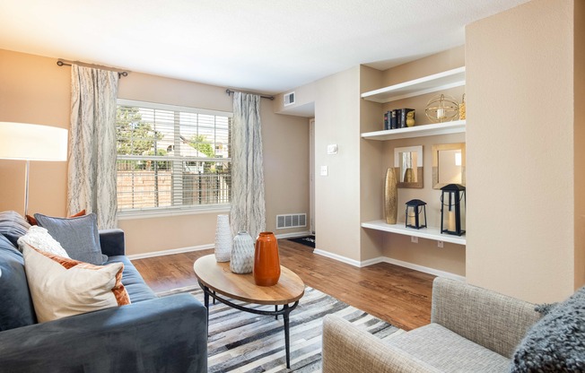 a living room with a couch and a table