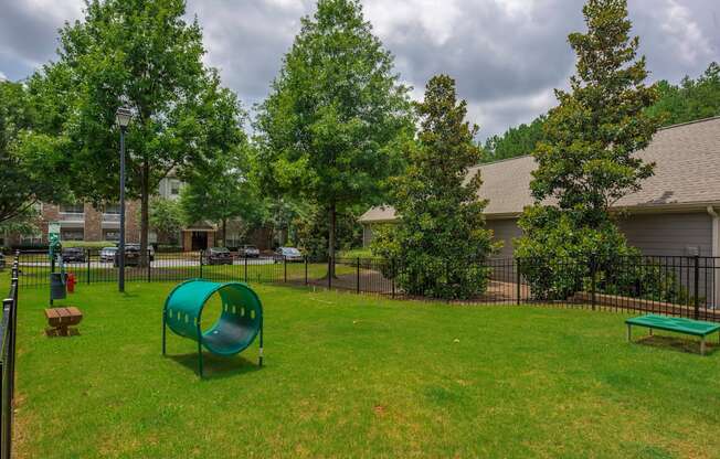 our apartments have a park with a playground and a green slide