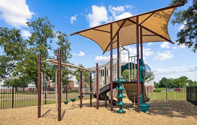 a playground with a swing set and a slide