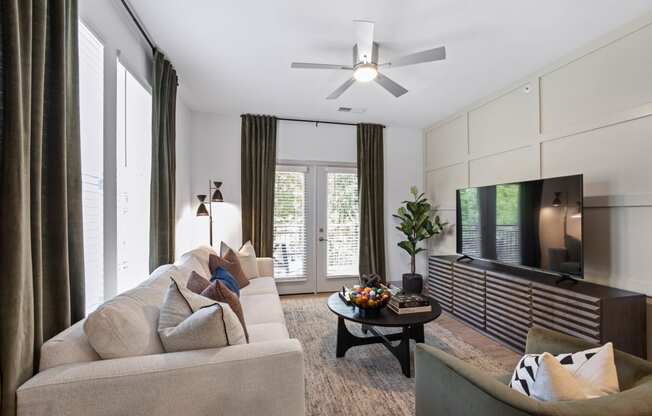 a living room with a couch and a tv