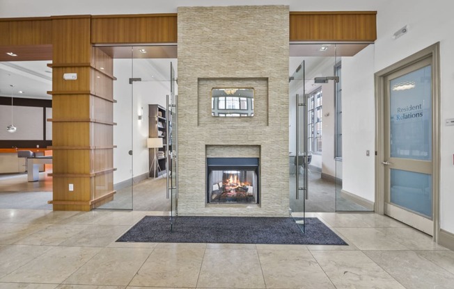a fireplace in the center of the lobby  at Harbor Pointe, New Jersey, 07002