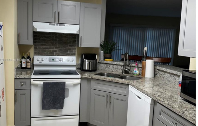 2-bedroom, 2-bathroom condo in a well-maintained gated community, featuring a spectacular direct lake view