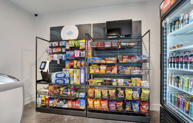 A refrigerated display case filled with snacks and drinks.