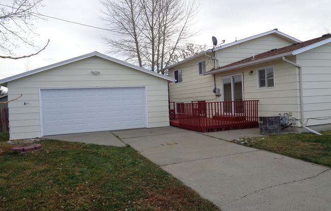 4 Bedroom House with Newer Carpet and oversized 2 Car Garage!