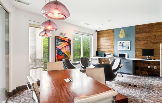 a conference room with a long wooden table and chairs