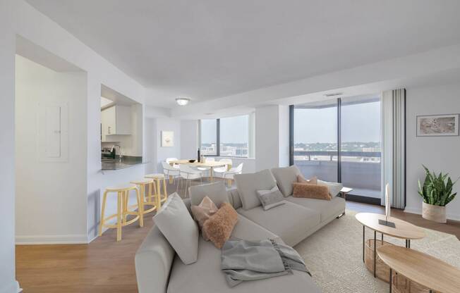 a living room with a couch and a table with chairs