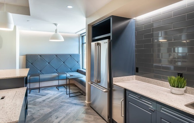 a kitchen with a stainless steel refrigerator and a counter top
