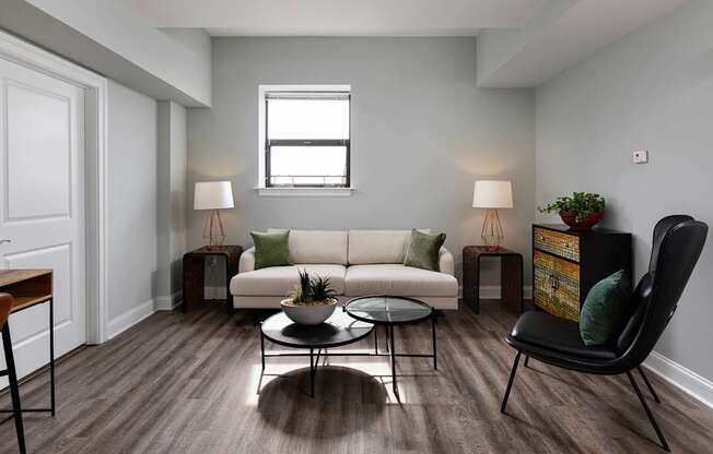 Airy living space with neutral tones and ample natural light, highlighting the luxury of Rittenhouse Square apartments Philadelphia PA.