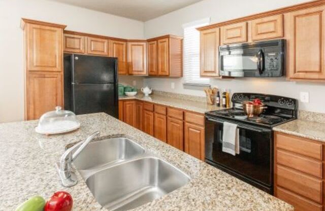 Gourmet Kitchen With Island at San Tropez Apartments & Townhomes, South Jordan