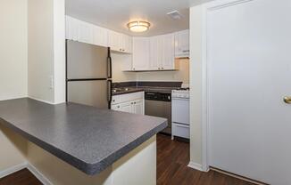 a kitchen with an island in the middle of a room