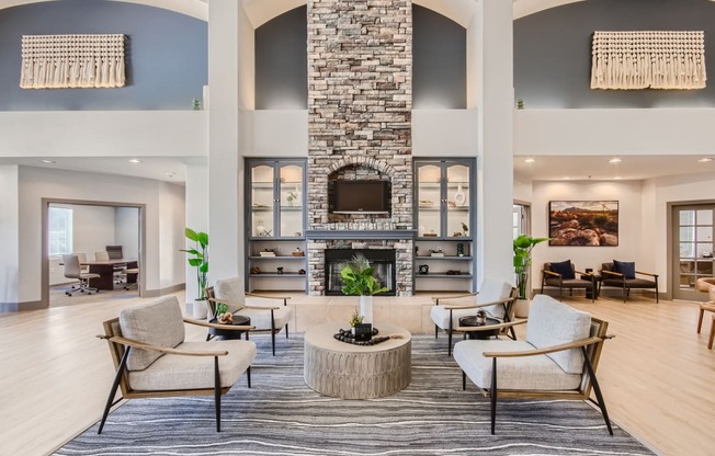 the preserve at ballantyne commons clubhouse with a fireplace and seating areas