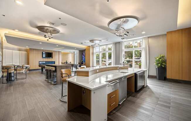 A modern kitchen with a large island and a dining area.