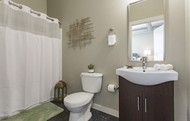 Gale Lofts Spacious Bathroom with Vanity and Large Shower Tub