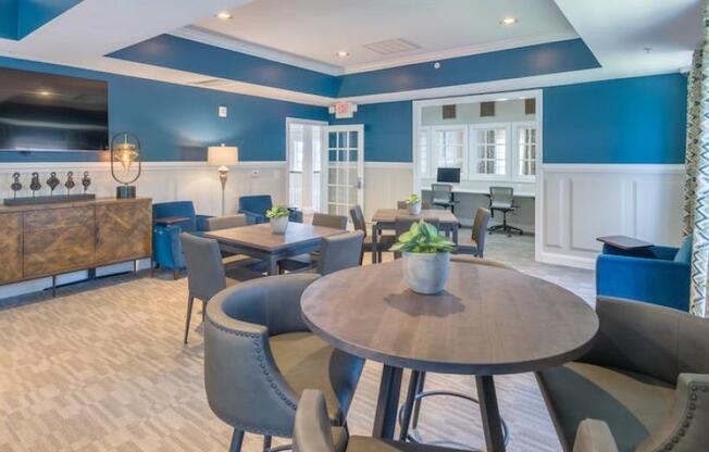 a large room with tables and chairs and a bar at Sterling Manor, Williamsburg, VA