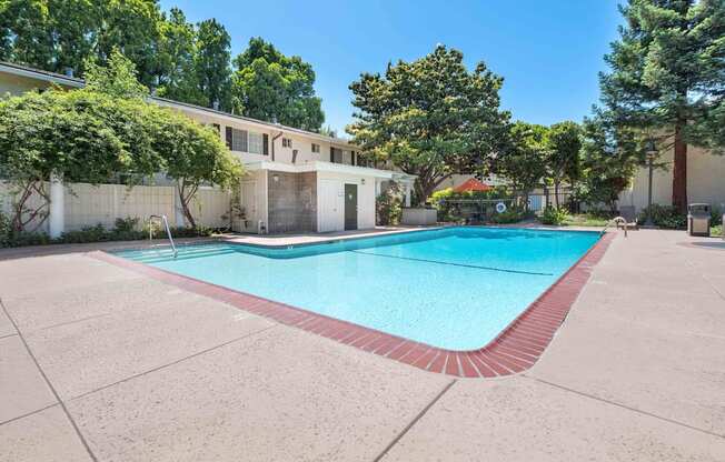 Apartments for Rent in San Jose CA - Los Gatos Creek - Pool with Poolside Restrooms Surrounded by Lush Landscaping