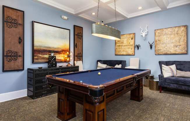 Resident lounge with billiard table at Adrian on Riverside in Macon, GA
