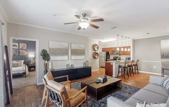 a living room with a couch and a table at Cumberland Place Apartment Homes, Tyler, TX 75703