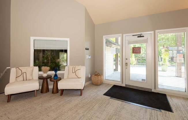 A living room with a sofa, a table, and a window at Sunstone Parc, Beaverton, OR, 97008