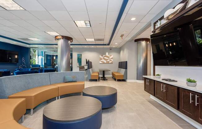 A modern office space with a blue and orange color scheme.