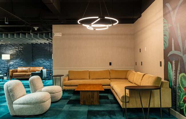 a living room with couches chairs and a table