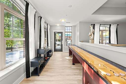 A long, narrow room with a wooden counter and benches.