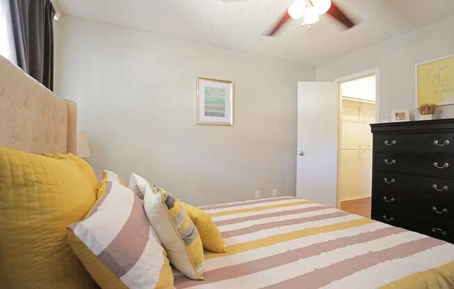 Furnished bedroom with ceiling fan