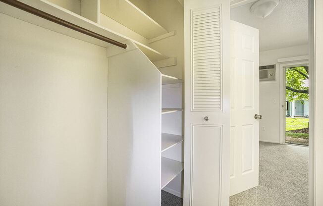 a large closet with shelves at Newport Village Apartments, Portage, MI