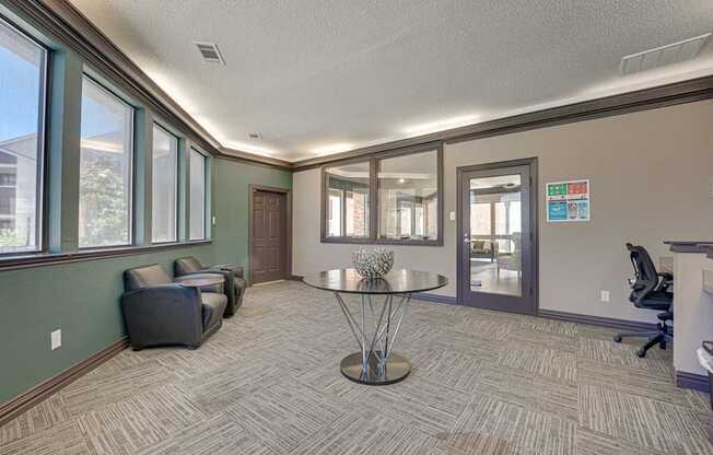 A room with a table and chairs in it.