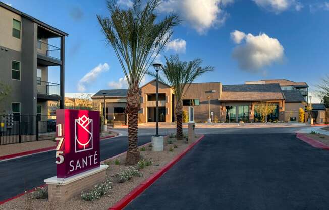 an apartment building with a sign that says 5 smile in front of it