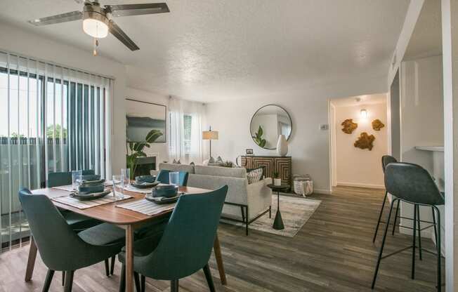 an open living room and dining room with a table and chairs