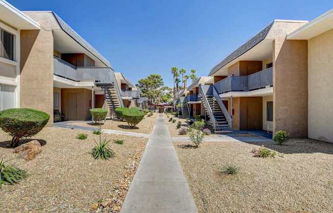 A row of modern houses with balconies and staircases.