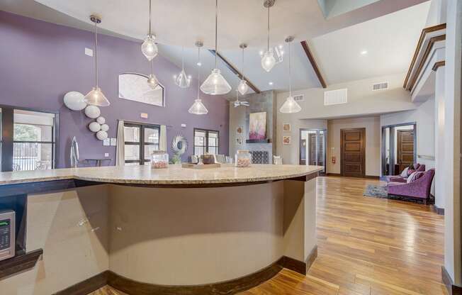 a kitchen with purple walls and a counter top