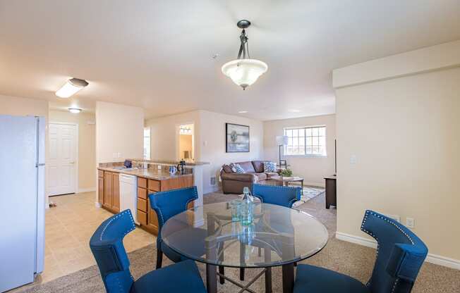 a living room with a glass table  and a kitchen  at Quail Springs, West Richland, Washington