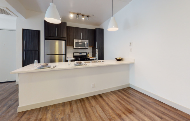 Reimagined kitchen with granite countertops and stainless steel appliances