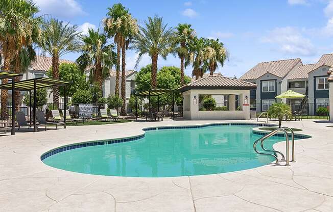 Community Swimming Pool with Pool Furniture at Monterra Apartments located in Las Vegas, NV.