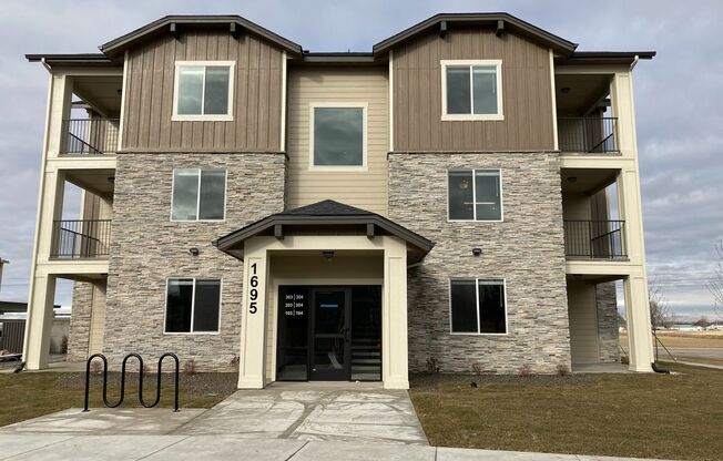 1695 Grand Fork #103~Built in 2020 w/ Clubhouse + Pool, Pet Friendly & Covered Parking!
