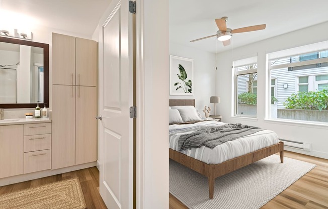 A bedroom with a bed, a dresser, and a mirror.