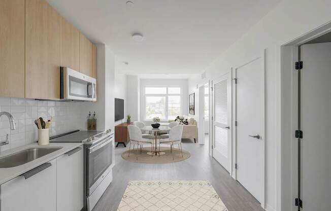 A modern kitchen with a dining table set for four.