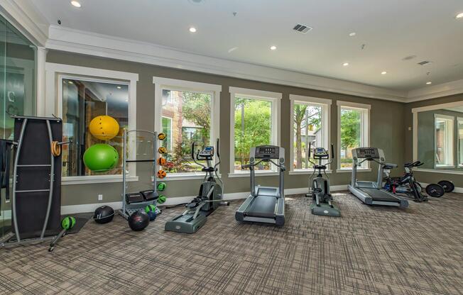 a living room filled with furniture and a flat screen tv