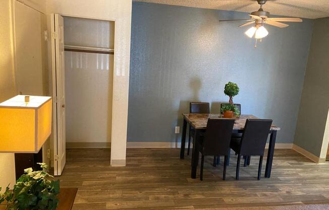 a dining room with a table and chairs