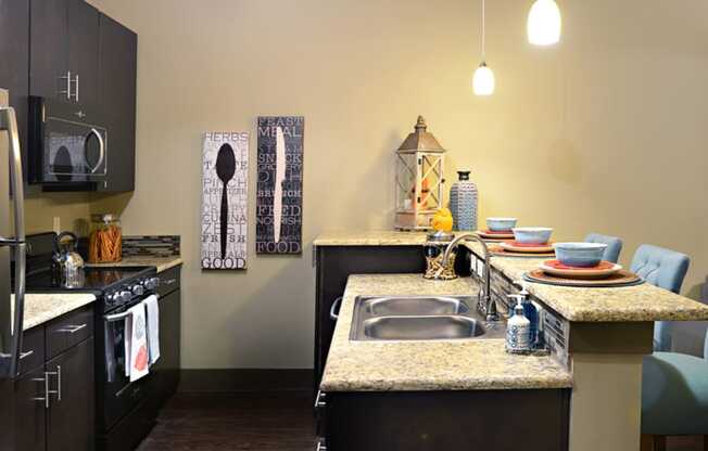 a kitchen with a sink and a counter top in a home