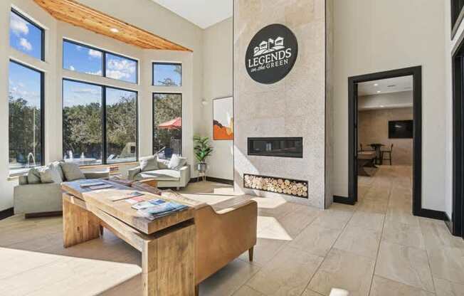 a living room with a fireplace and a wooden table