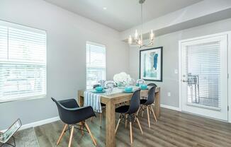a living room filled with furniture and a large window