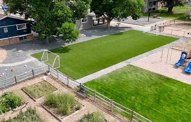 A soccer field with a goal in the middle of it.