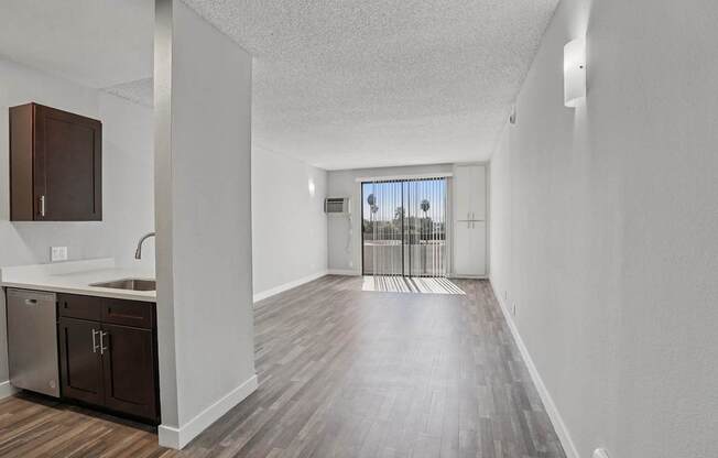 A kitchen with a sink and cabinets.