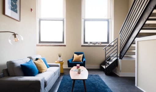 a living room with a couch and a table