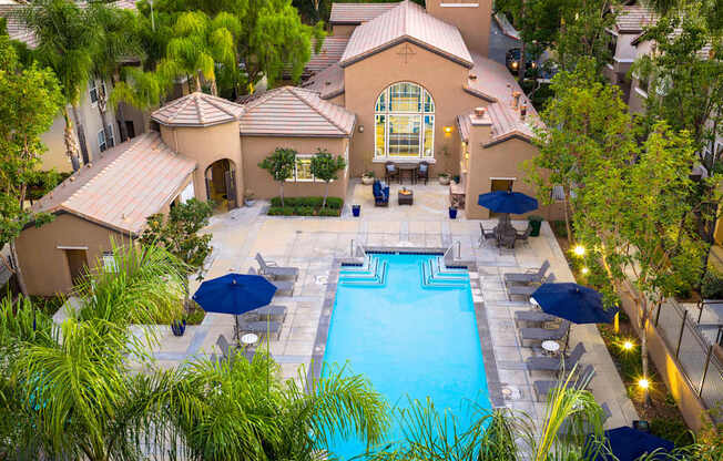A large house with a pool in the backyard.